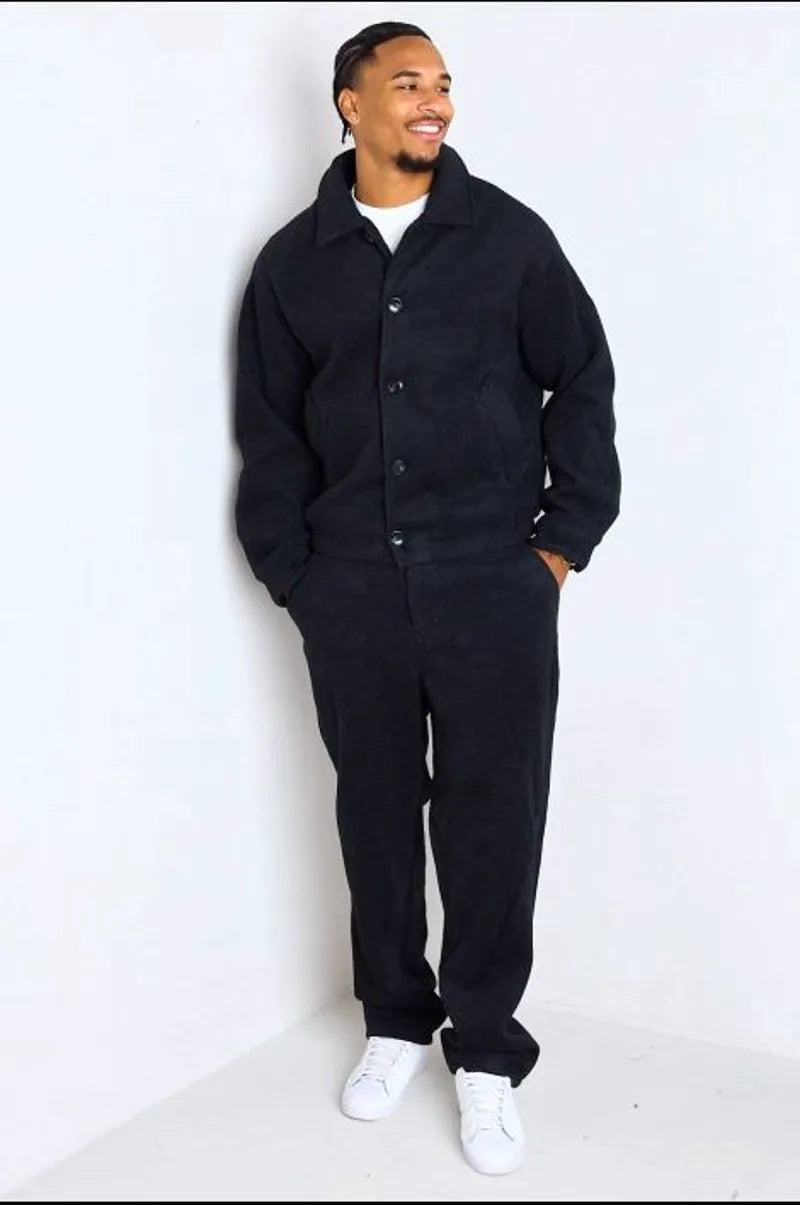 Black two-piece ensemble: jacket + trousers