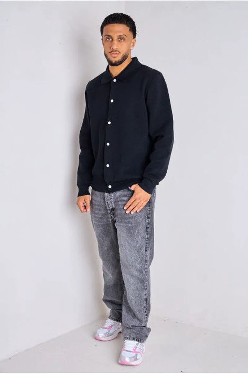 Black sweater vest with fold-over collar