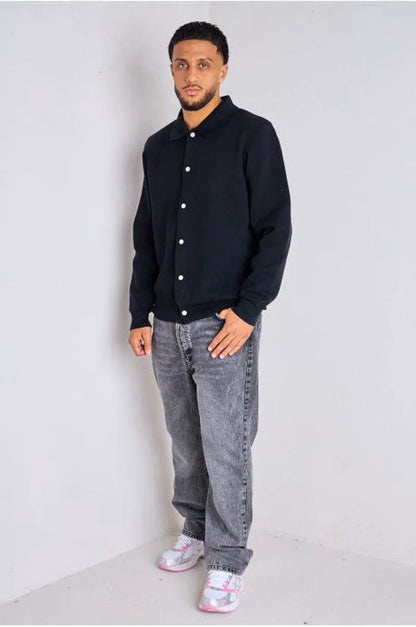 Black sweater vest with fold-over collar