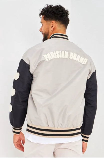 Gray bomber jacket with black sleeves embroidered with "parisian brand"