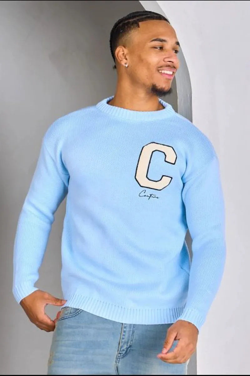 Light blue knitted sweater with "c" logo