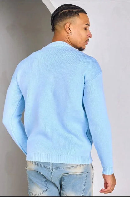 Light blue knitted sweater with "c" logo