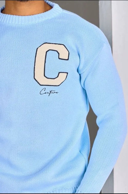Light blue knitted sweater with "c" logo
