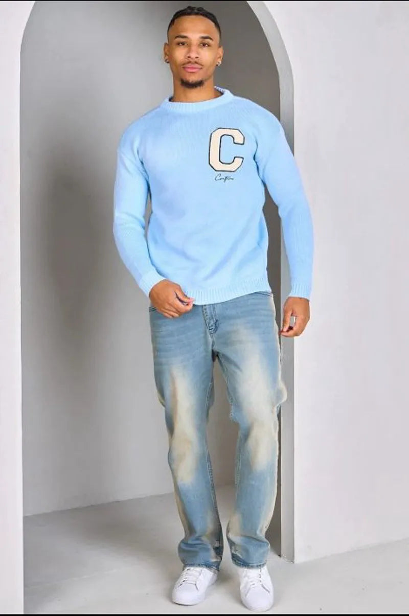 Light blue knitted sweater with "c" logo