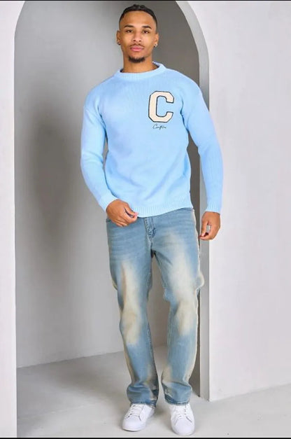 Light blue knitted sweater with "c" logo
