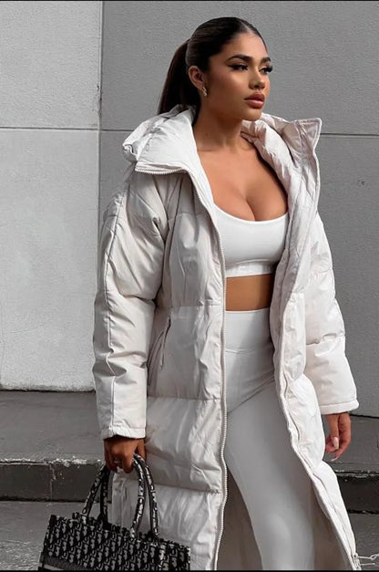 Long beige quilted down coat with double zipper closure