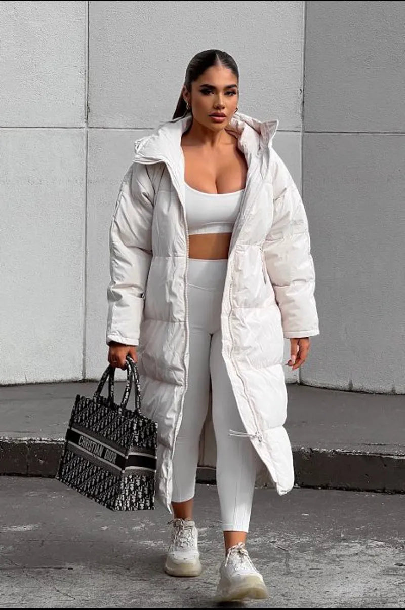 Long beige quilted down coat with double zipper closure
