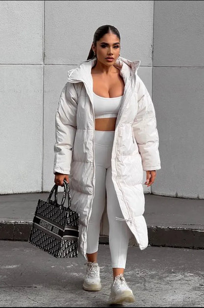 Long beige quilted down coat with double zipper closure