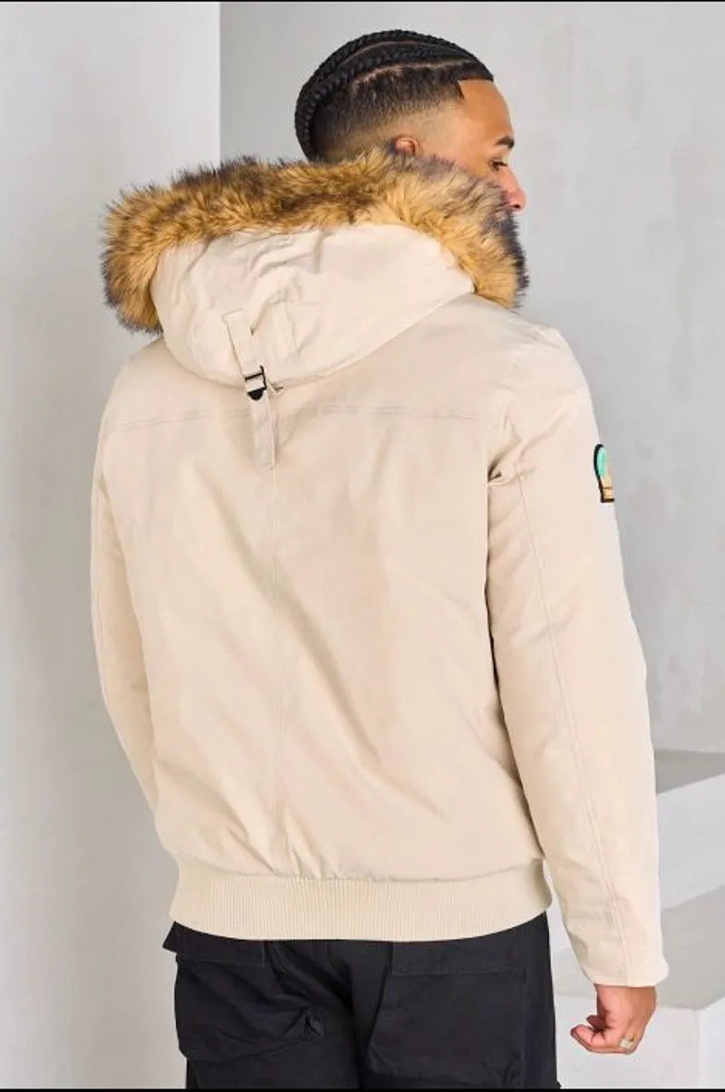 Beige hooded parka with fur trim