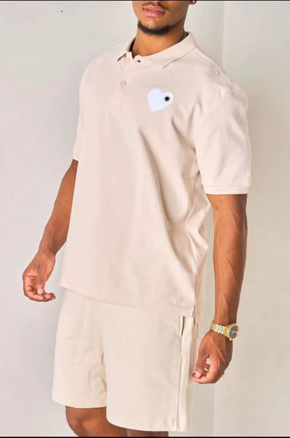 Beige polo with heart appliqué