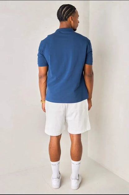 Navy blue polo with heart patch