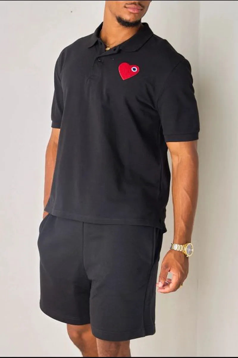 Black polo with heart appliqué