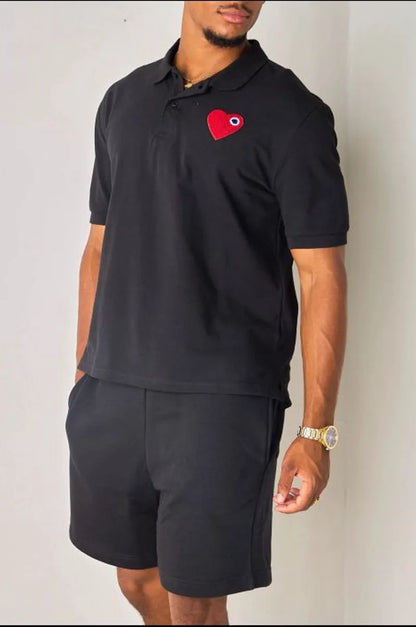 Black polo with heart appliqué