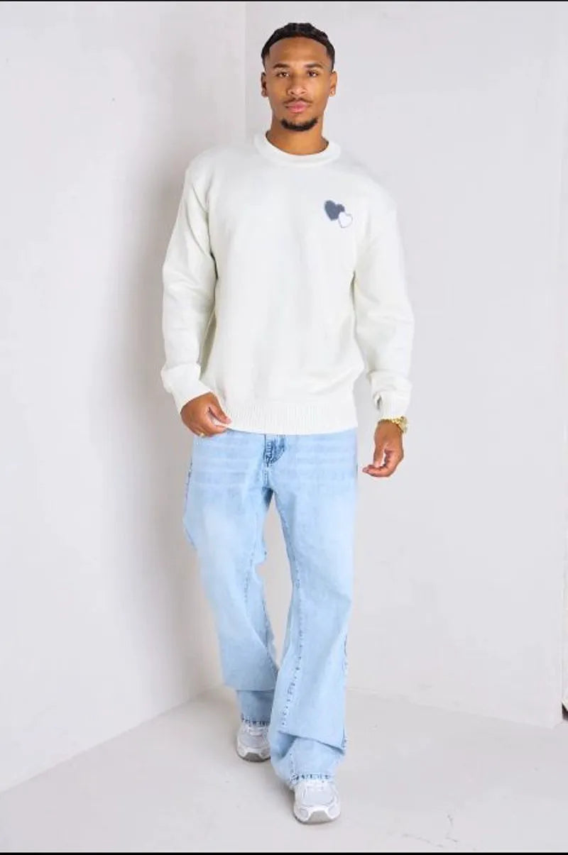 White knitted sweater with heart embroidery