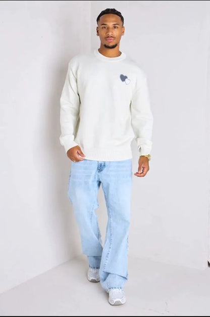 White knitted sweater with heart embroidery