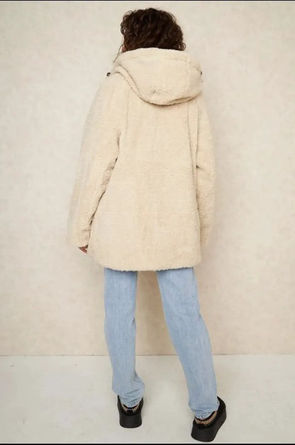 Reversible black down jacket with faux fur-lined hood