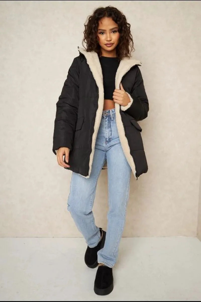 Reversible black down jacket with faux fur-lined hood
