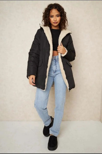 Reversible black down jacket with faux fur-lined hood