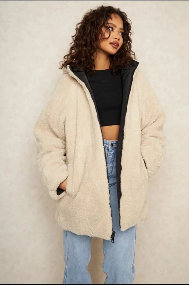 Reversible black down jacket with faux fur-lined hood