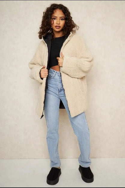 Reversible black down jacket with faux fur-lined hood