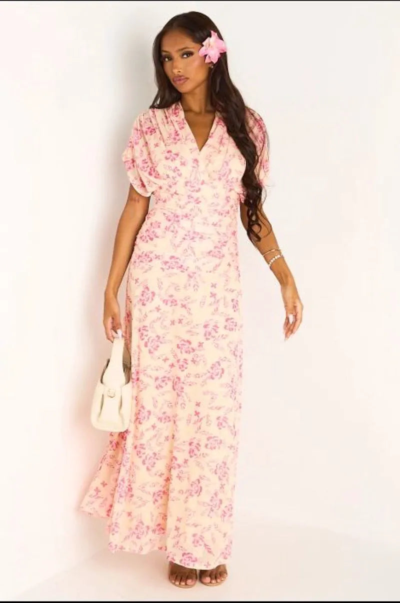 Robe jaune à motifs floraux rose et effet drapé