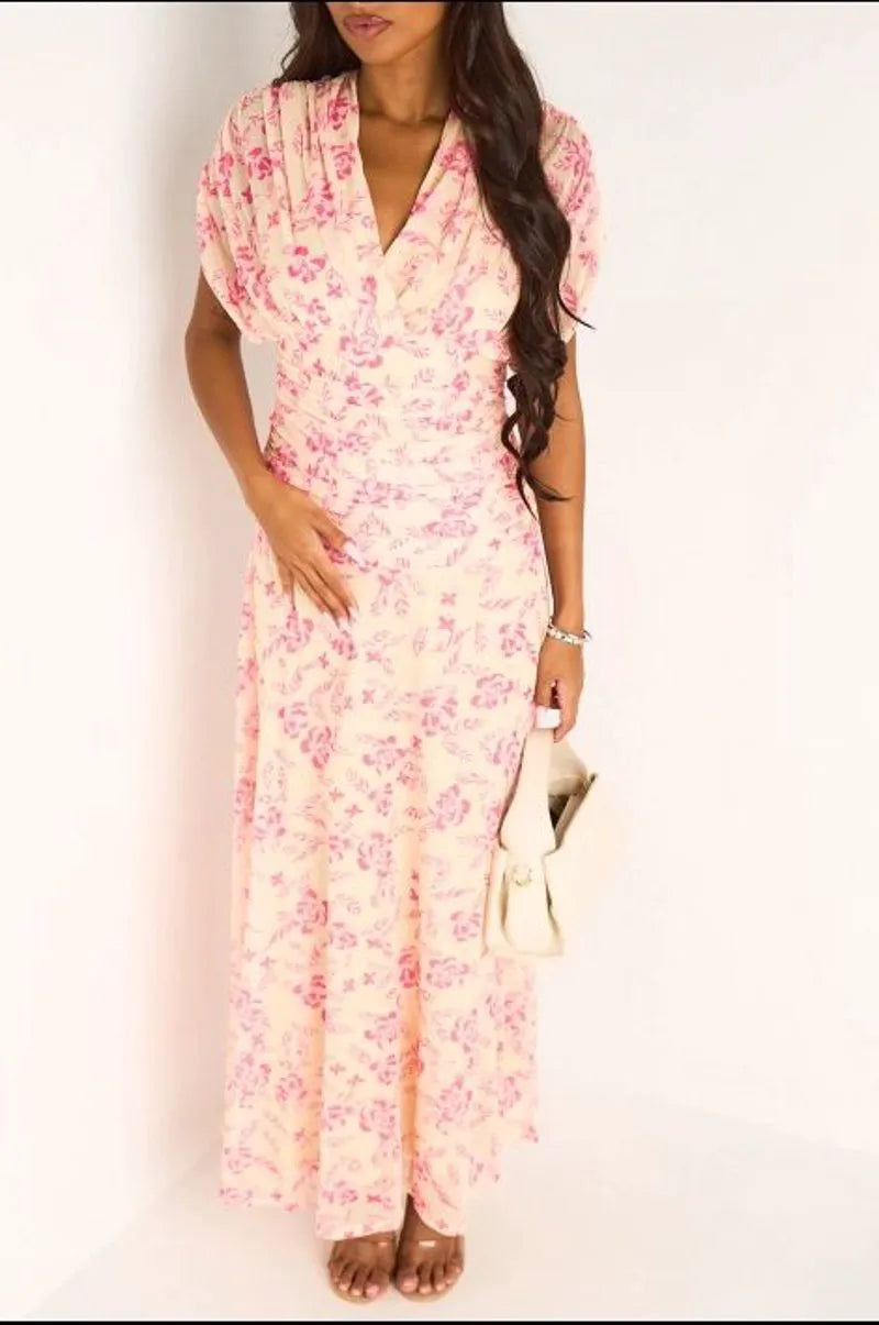 Robe jaune à motifs floraux rose et effet drapé