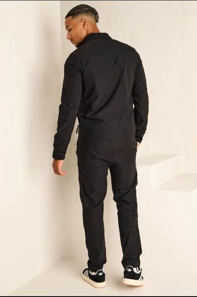 Two-piece ensemble: satin black bomber jacket and jogger pants.