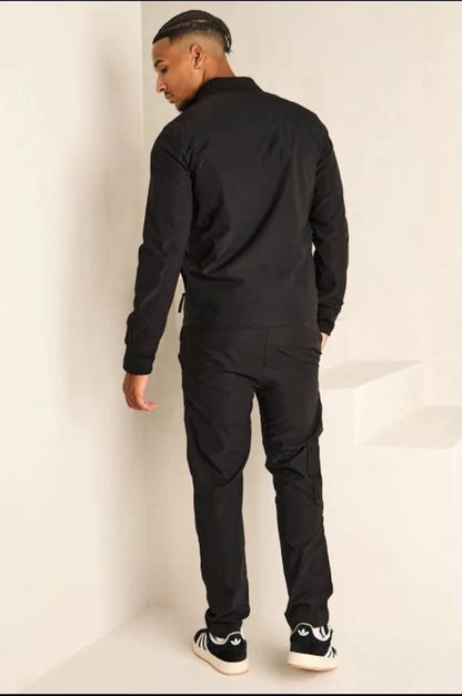 Two-piece ensemble: satin black bomber jacket and jogger pants.