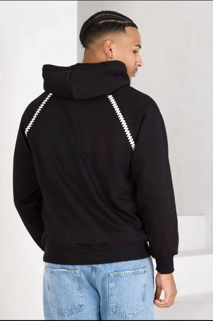 Black sweatshirt with two-tone details and kangaroo pocket.