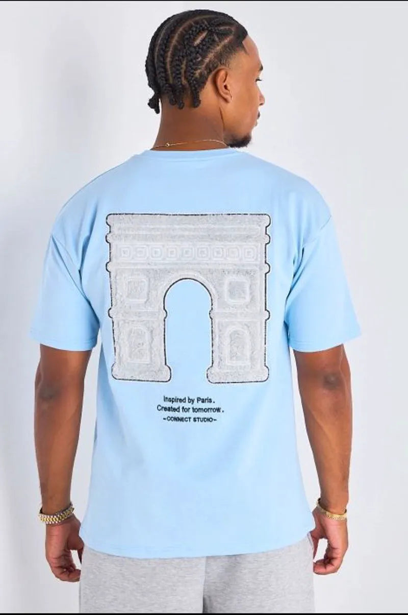 T-shirt bleu clair à imprimé et inscription "inspired by paris "