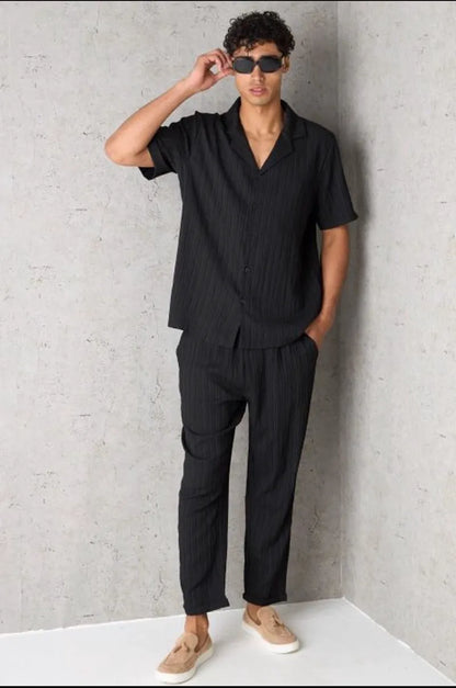 Two-piece ensemble: textured black shirt and trousers