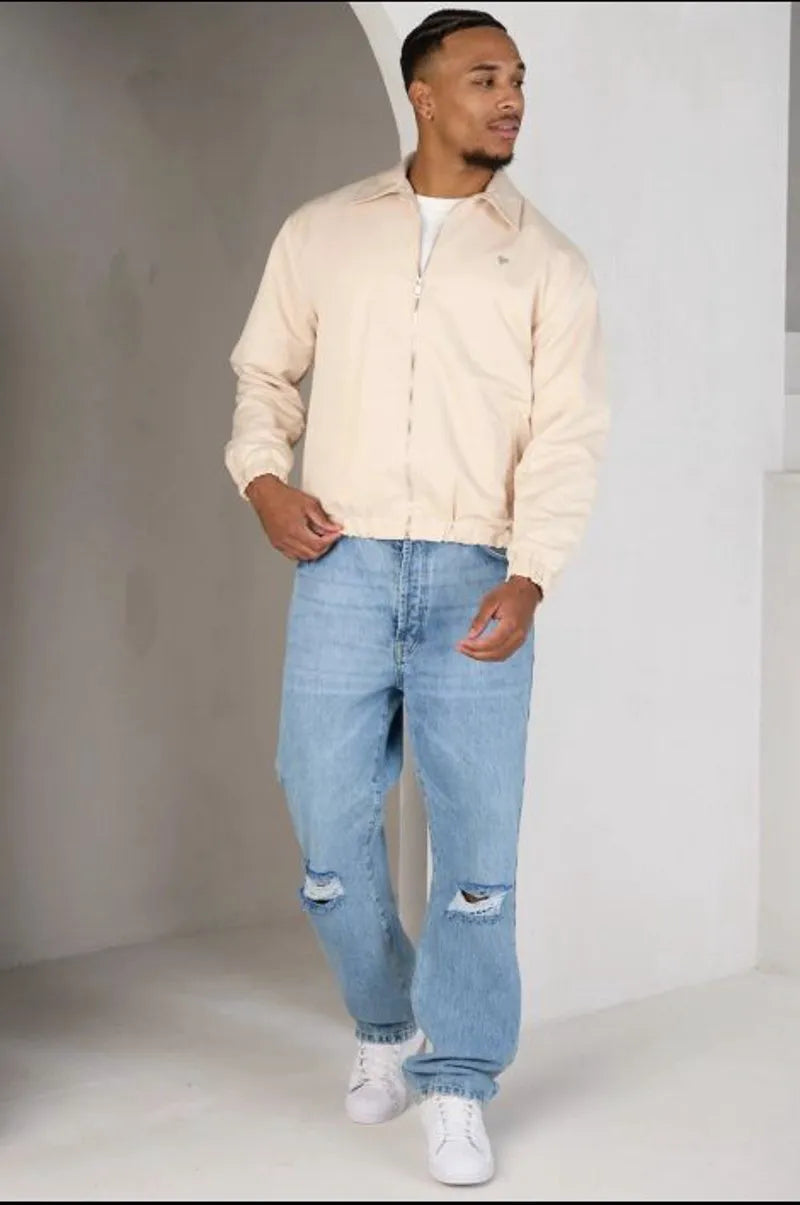 Beige zip-up jacket with a heart on the chest