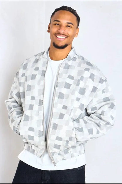 Gray bomber-style jacket with square geometric patterns
