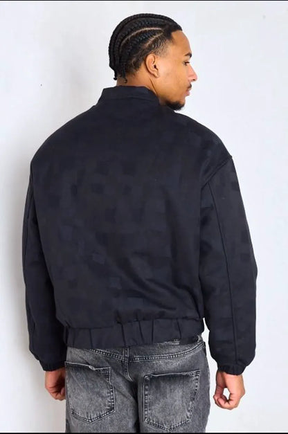 Black bomber-style jacket with square geometric patterns